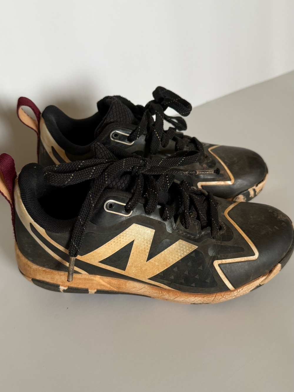 New Balance Black and white Romero Cleats